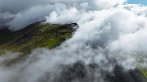 Flying Through Clouds Above Green Hills Paradise Heaven Mountain Range with High Peaks Wonderful