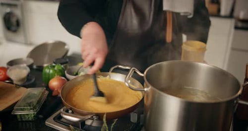 Chef Preparing Delicious Meal in Kitchen