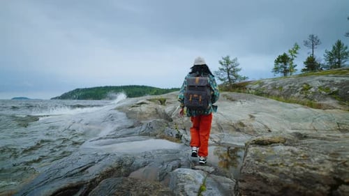 Ecotourism And Backpacking In Nature Back View Of Woman Tourist With Backpack SlowMotion
