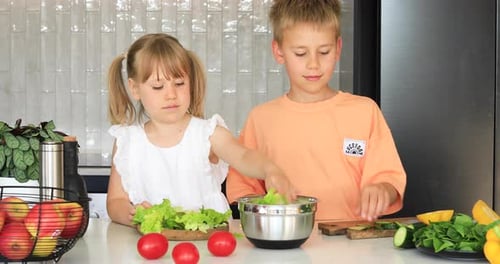 Children Making Salad at Home in Kitchen