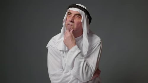 Mature Man Posing in Thoughtful Studio Portrait