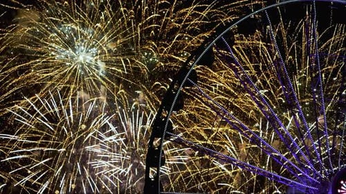 Colorful fireworks at a ferris wheel, during nighttime in Chicago, Illinois, USA