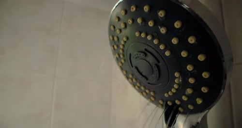 A Closeup of a Shower with Water Flowing From It