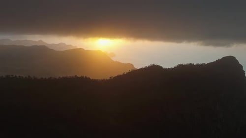 Aerial view of mountains and clouds at sunset, Spain.