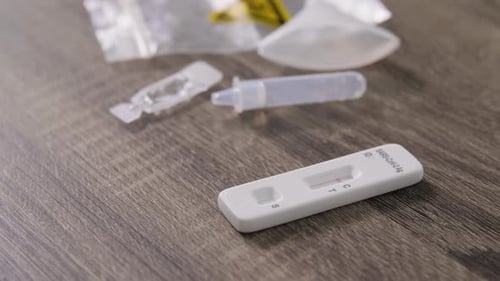 Rapid Covid test shows positive result on table