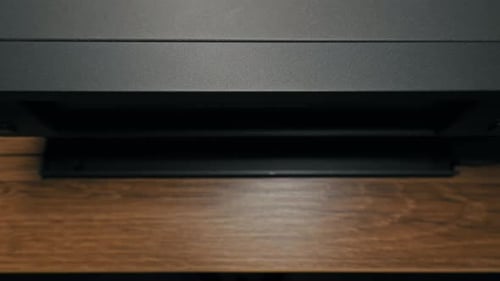 VHS Tape Being Inserted Into a VCR