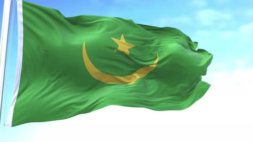 Mauritania National Flag Waving in Wind Against Blue Sky