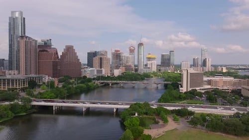 Aerial View of Downtown Austin Texas in a Sunny Day Featuring the Iconic Skyline Colorado River Lush
