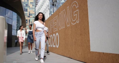 Group of teenagers walking through city