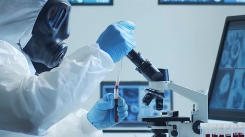 Scientist in Hazmat Suit Analyzing Blood Sample