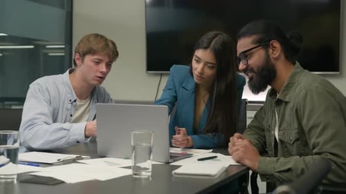 Company Teamwork at Office Desk Talk Planning Discuss Online Project Laptop Multiethnic Business