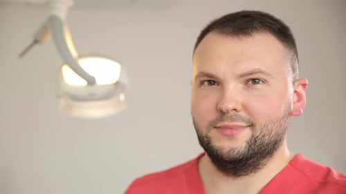 Doctor Smiling in Brightly Lit Office Environment