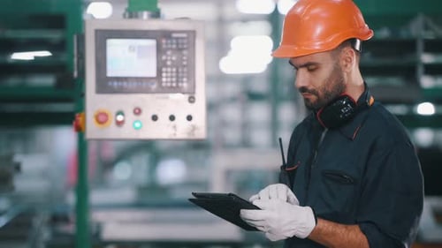Production of the windows. Man is working in the modern factory.
