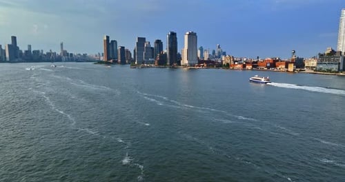 Flight over the waterscape of the East River flowing in New York, USA.