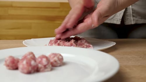 Forming Ground Meat into Meatballs on Plate