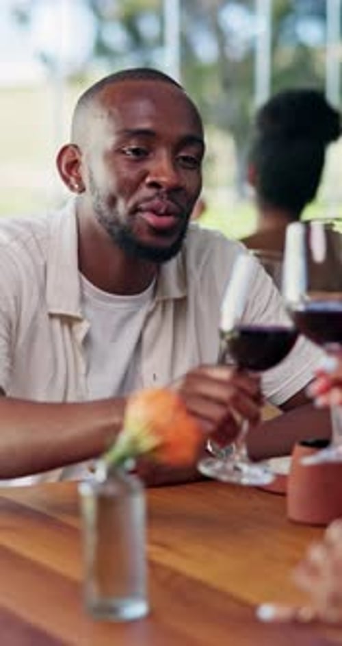 Restaurant, couple and man toast with wine on date for bonding, celebrate and anniversary