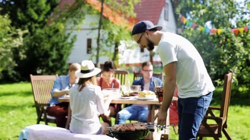 Friends Enjoying a Summer Barbecue in a Garden