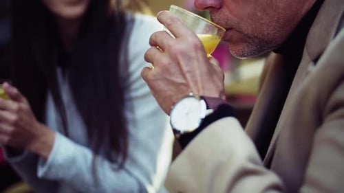 Business partners talk in a prague cafe on an autumn day close up slow motion