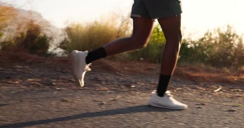 Man Running on Path at Sunrise, Low Angle
