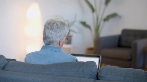 Senior Person Working on Laptop from Home