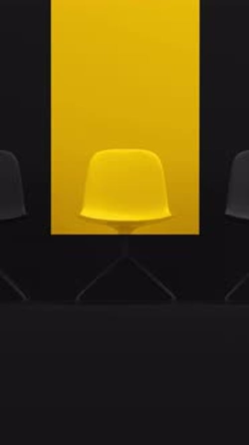 Yellow chair chosen from a row of black ones