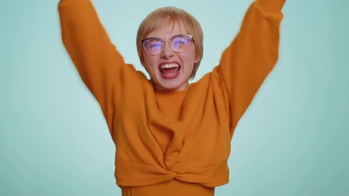 Woman Crossing Fingers and Celebrating Success