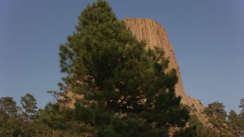 Devils tower Wyoming majestic rock formation under a summer sky in the United States