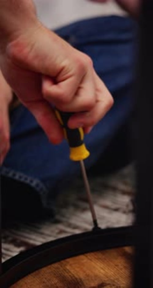 Home, furniture and hands of person with screwdriver for building, diy project and assembly