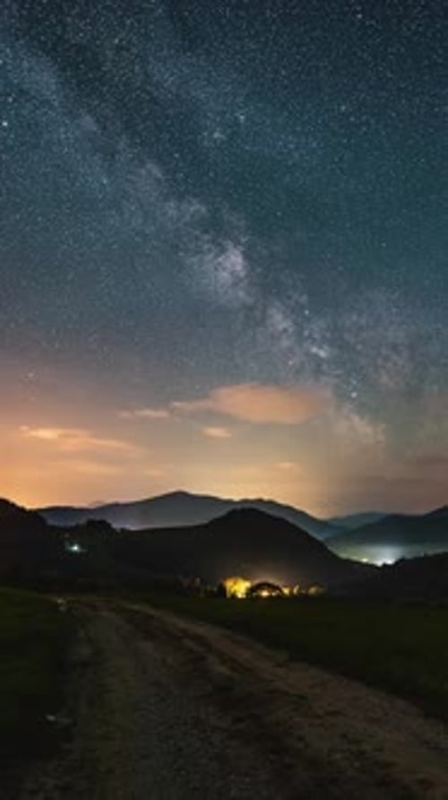 Vertical Video of Milky Way Galaxy Stars Moving Over Countryside Astronomy Time Lapse