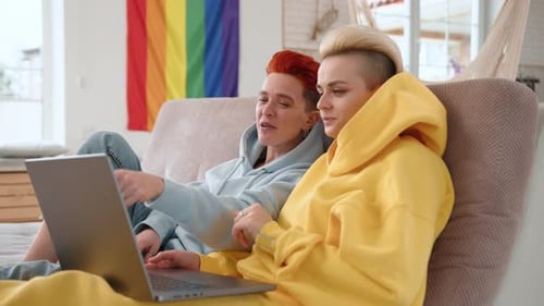 Couple Relaxing Together with Laptop at Home