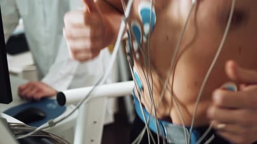 Muscular Man Athlete Running on Treadmill in Gym for Monitoring Test His Sport Performance