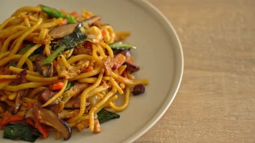 Stir Fried Noodles with Vegetables and Meat on Plate