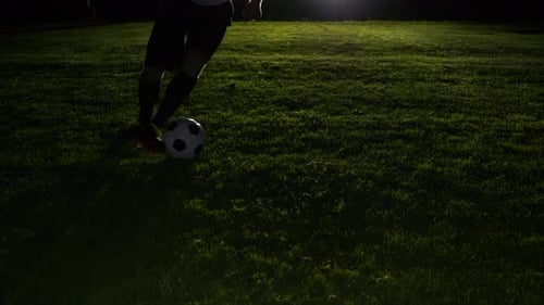 Soccer Player Athlete Training Foot Ball Sport on Soccer Field at Night