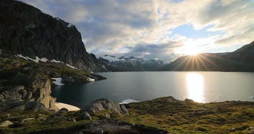 Sunset against the backdrop of the Norwegian mountains. Beautiful Nature Norway natural landscape.