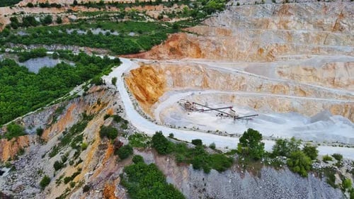 Natural Quarry is Located Near Road Against Backdrop of Rhodope Mountains and Hills with Forests and