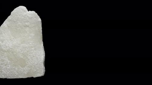 dried coconut rotate, on a black background close-up. In move