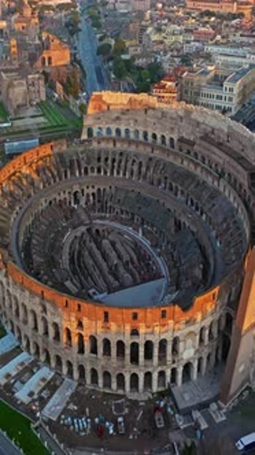 Aerial View of Iconic Ancient Arena of Colosseum at Sunset Flavian Amphitheatre in the Heart of Rome
