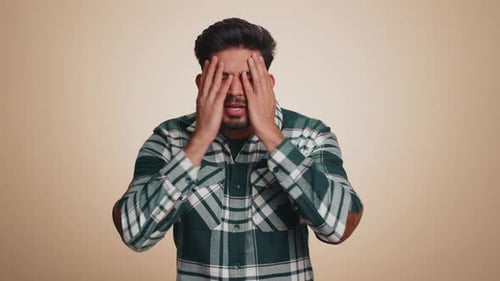 Man Expressing Frustration and Confusion in Studio