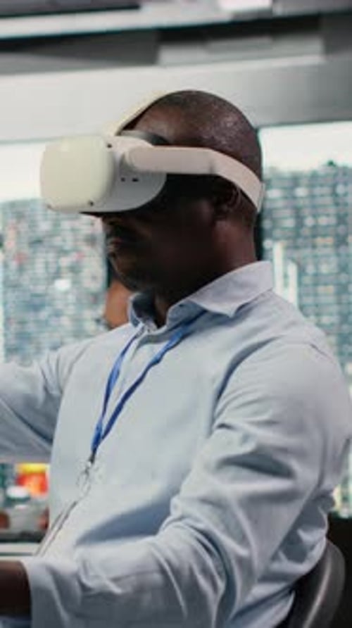 Vertical Video Technician in Office Using VR Headset Equipment to Accelerate AI Calculations