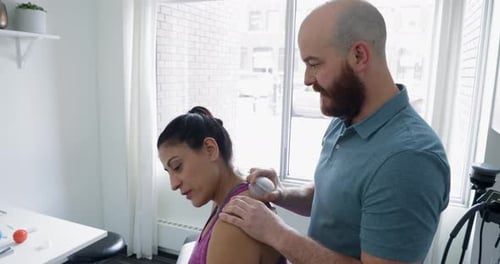 Woman Receives Cupping Therapy Treatment in Clinic