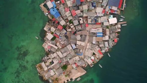 Santa cruz islote densely populated island in the middle of the sea. Aerial top down view