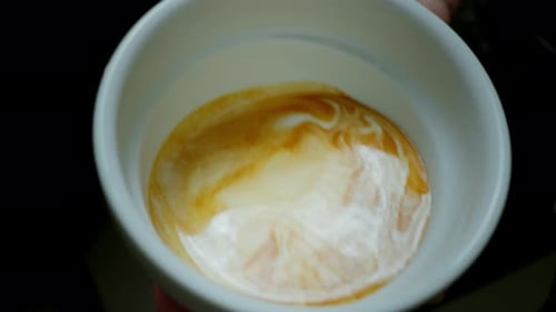 Barista Make Coffee Latte Art with Coffee Espresso Machine in Coffee Shop