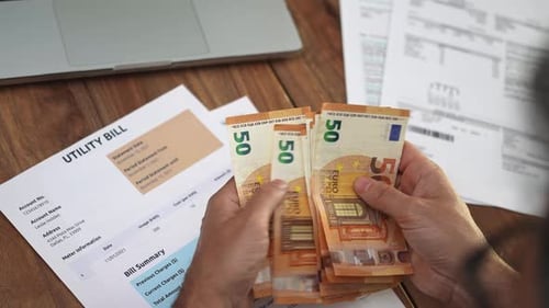 Counting Euro Cash to Pay Utility Bill