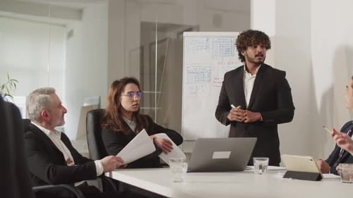 Colleagues Presenting at Corporate Boardroom Meeting