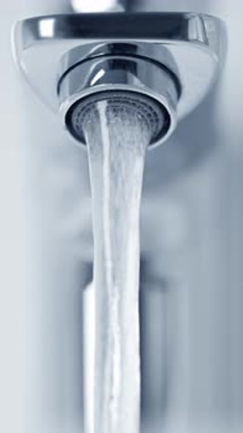 Close-up of running tap water