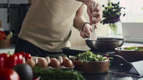 Person Cooking in a Modern Kitchen With Fresh Ingredients