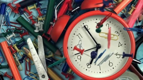Paper Clips Fall on the Alarm Clock Filmed on a Highspeed Camera at 1000 Fps