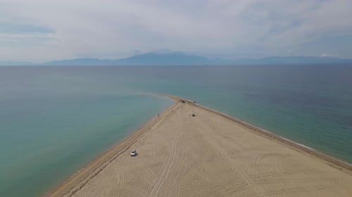 4k taking off clip over a peninsula on the tropical beach of Epanomi, Halkidiki, Greece