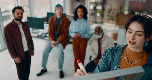 Diverse Team Collaborates on Strategy in Modern Office