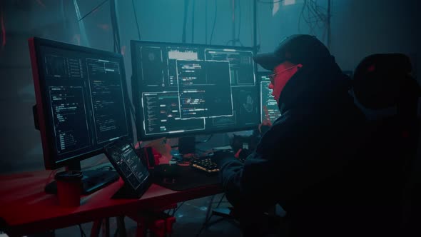 Asian Hacker Using Multiple Monitors for Malware Attack, Technology ...